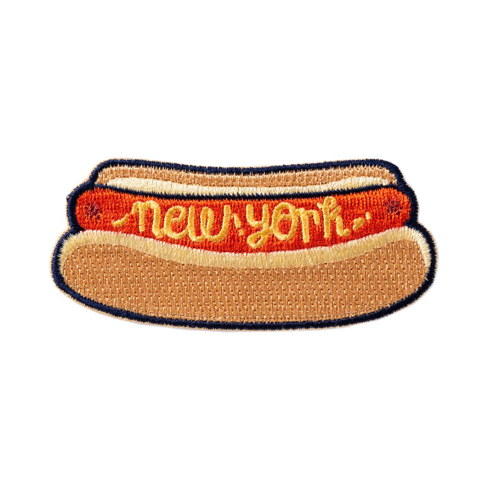 Hot dog-shaped patch with 'New York' text on a white background