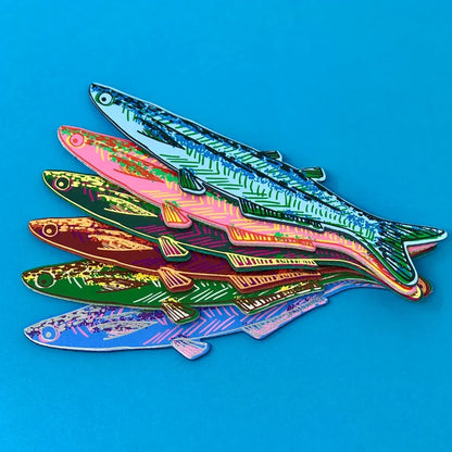 Colorful fish-shaped leather bookmarks on a blue background