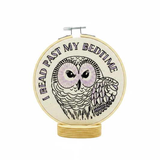 Embroidery kit with owl design and text 'I read past my bedtime' on a white background