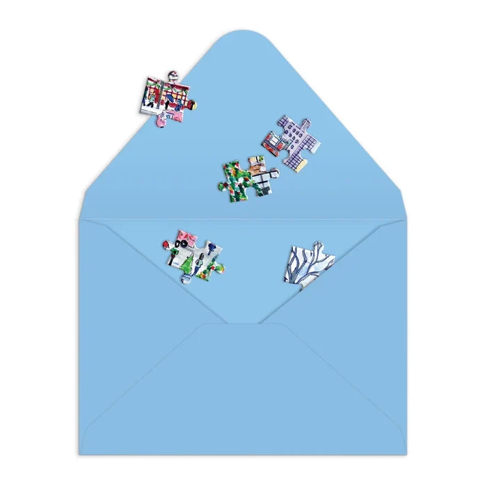Blue envelope with colorful puzzle piece stickers on a white background