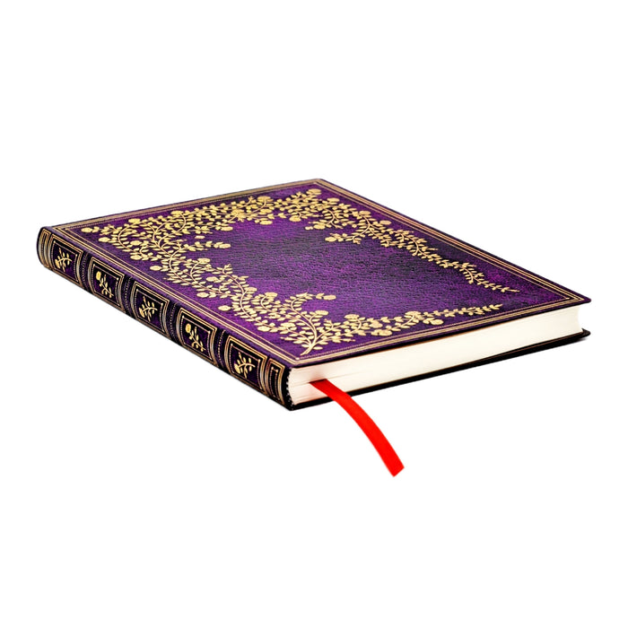 Purple book with gold floral patterns on a white background